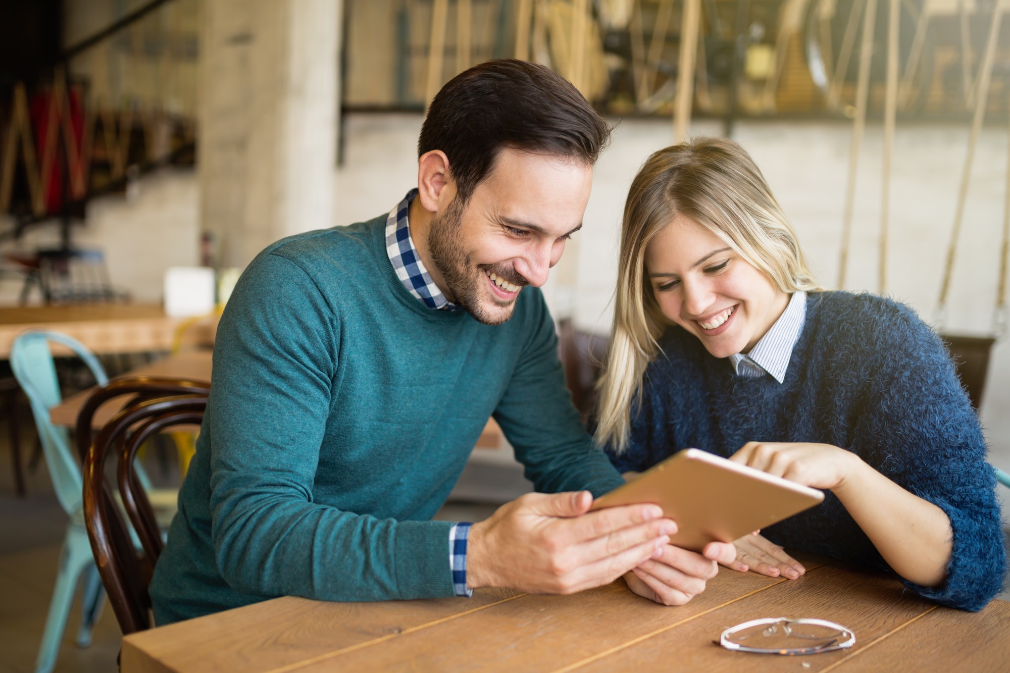 Happy couple surfing on tablet